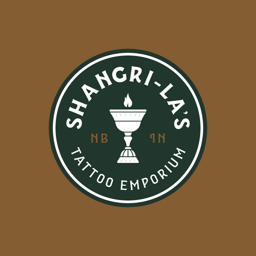 Shangri-La's Tattoo Emporium logo design by logo designer Decree Design Co for your inspiration and for the worlds largest logo competition